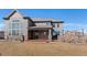 Large backyard, features a stone patio and lush lawn, ideal for outdoor enjoyment at 1150 Maddox Ct, Broomfield, CO 80023