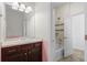Cozy bathroom featuring a single vanity, shower and tub combo, and updated lighting at 1150 Maddox Ct, Broomfield, CO 80023