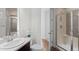 Cozy bathroom featuring tiled floors, a glass enclosed shower and modern fixtures at 1150 Maddox Ct, Broomfield, CO 80023