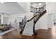 Elegant foyer with hardwood floors, staircase with wrought iron railings, and open view to the living spaces at 1150 Maddox Ct, Broomfield, CO 80023