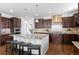 Kitchen area featuring a large island, granite countertops, and stainless steel appliances at 1150 Maddox Ct, Broomfield, CO 80023