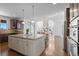 Open kitchen and living space with stainless steel appliances and granite counters at 1150 Maddox Ct, Broomfield, CO 80023