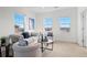 Cozy living room featuring a neutral color palette and ample natural light from the windows at 1150 Maddox Ct, Broomfield, CO 80023