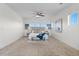 Bright and spacious main bedroom featuring a ceiling fan and multiple windows for natural light at 1150 Maddox Ct, Broomfield, CO 80023