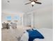 Bright and airy main bedroom featuring a ceiling fan, sitting area and multiple windows at 1150 Maddox Ct, Broomfield, CO 80023