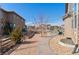 Landscaped backyard with gravel path and raised garden beds at 1150 Maddox Ct, Broomfield, CO 80023