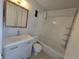 A full bathroom includes a tub and shower combo with a white vanity at 6009 Yarrow St # C, Arvada, CO 80004