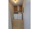 This convenient laundry room has washer and dryer hookups with overhead cabinets at 6009 Yarrow St # C, Arvada, CO 80004