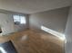 This cozy living room has wood floors and a bright window with natural light at 6009 Yarrow St # C, Arvada, CO 80004