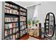 Home office featuring floor-to-ceiling bookshelves and natural light at 1448 Depew St, Lakewood, CO 80214
