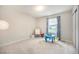 Bright ' room with carpet, window, play table, and furniture, creating a cute and functional space at 6092 S Ouray St, Aurora, CO 80016