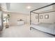 Spacious bedroom featuring plush carpet, a tray ceiling, and ample natural light creating a cozy and inviting atmosphere at 6092 S Ouray St, Aurora, CO 80016