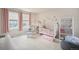Charming Bedroom with soft pink accents, creating a cozy and comforting environment for a baby at 6092 S Ouray St, Aurora, CO 80016
