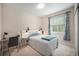 Comfortable bedroom featuring a well-lit desk area, plush carpet, and stylish decor creating a relaxing and productive space at 6092 S Ouray St, Aurora, CO 80016