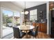 Breakfast nook boasts gray accent wall and a sliding glass door leading to the backyard at 6092 S Ouray St, Aurora, CO 80016