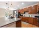 Bright kitchen features stainless steel appliances, ample counter space, and a breakfast bar at 6092 S Ouray St, Aurora, CO 80016