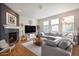 Inviting living room features a cozy fireplace, and a large comfy sectional sofa at 6092 S Ouray St, Aurora, CO 80016