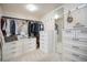 Organized walk-in closet featuring custom shelving, drawers, and ample hanging space for efficient storage solutions at 6092 S Ouray St, Aurora, CO 80016