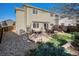 Expansive backyard with a stone patio, perfect for outdoor living and entertaining at 10359 Tracewood Dr, Highlands Ranch, CO 80130
