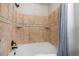 Elegant bathroom featuring a soaking tub with tile surround and decorative accents at 10359 Tracewood Dr, Highlands Ranch, CO 80130