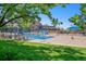Inviting community pool with lounge chairs, shade structures, and well-maintained grounds at 10359 Tracewood Dr, Highlands Ranch, CO 80130