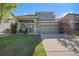 Charming two-story home featuring a well-manicured lawn and a two-car garage at 10359 Tracewood Dr, Highlands Ranch, CO 80130
