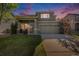 Charming two-story home featuring a well-manicured lawn and a two-car garage at 10359 Tracewood Dr, Highlands Ranch, CO 80130