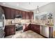 Well-lit kitchen featuring stainless steel appliances, granite countertops, and tile backsplash at 10359 Tracewood Dr, Highlands Ranch, CO 80130