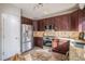 Bright kitchen showcasing stainless steel appliances, granite countertops, and tile flooring at 10359 Tracewood Dr, Highlands Ranch, CO 80130