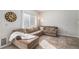 Comfortable living room featuring a large sectional sofa and sunlit window at 10359 Tracewood Dr, Highlands Ranch, CO 80130
