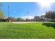 Enjoy the community volleyball court with a vibrant grassy lawn and access to nearby building amenities at 10359 Tracewood Dr, Highlands Ranch, CO 80130