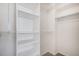 Spacious walk-in closet with custom shelving at 10359 Tracewood Dr, Highlands Ranch, CO 80130