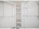 Spacious walk-in closet with multiple shelving units, providing ample storage space at 10359 Tracewood Dr, Highlands Ranch, CO 80130