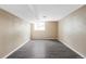 Finished basement with gray vinyl floors, neutral walls and a small window that lets in natural light at 212 Mulligan Lake Dr, Mead, CO 80542