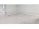 Large finished basement with neutral carpet and white trim. Plenty of room for entertaining at 212 Mulligan Lake Dr, Mead, CO 80542