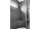 Modern shower with tiled walls and bench at 212 Mulligan Lake Dr, Mead, CO 80542