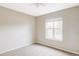A simple bedroom with carpet and a view to the outside at 212 Mulligan Lake Dr, Mead, CO 80542