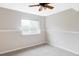 Neutral bedroom featuring carpet, white walls, white trim and a ceiling fan at 212 Mulligan Lake Dr, Mead, CO 80542