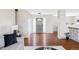 Lovely foyer with hardwood floors, neutral walls, coat closet, chandelier, and staircase at 212 Mulligan Lake Dr, Mead, CO 80542