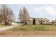 Charming single Gathering home with mature trees, well-manicured lawn, and a long private drive at 212 Mulligan Lake Dr, Mead, CO 80542