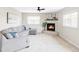 Inviting living room features a corner fireplace, plush sectional, and neutral decor at 212 Mulligan Lake Dr, Mead, CO 80542