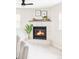 Tile fireplace in living room with decorative mantle and nearby windows for natural light at 212 Mulligan Lake Dr, Mead, CO 80542