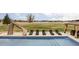 Enjoy relaxing by the in-ground pool with a water slide and lounge chairs at 212 Mulligan Lake Dr, Mead, CO 80542