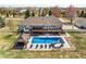 Aerial view of in-ground pool, hot tub, gazebo, large deck, patio and manicured lawn at 212 Mulligan Lake Dr, Mead, CO 80542