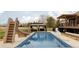 Enjoy this refreshing in-ground pool with a water slide and a covered patio area at 212 Mulligan Lake Dr, Mead, CO 80542