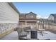 Backyard with patio seating, gravel, and turf, perfect for outdoor entertaining at 9786 Rosalee Peak St, Littleton, CO 80125