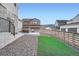 Landscaped backyard featuring gravel, turf, and a patio area with comfortable seating at 9786 Rosalee Peak St, Littleton, CO 80125