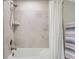 Bathroom with a bathtub and tile surround at 9786 Rosalee Peak St, Littleton, CO 80125