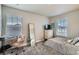 Cozy bedroom with carpet, a full-length mirror, and bright natural light at 9786 Rosalee Peak St, Littleton, CO 80125