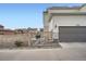 Exterior shot of the home with an attached garage at 9786 Rosalee Peak St, Littleton, CO 80125